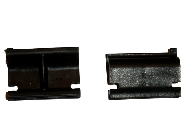 A pair of black Thetford fridge vent locking clips.